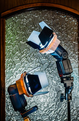 Fototapeta premium External flash with shutters on tripods.