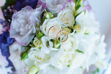 Wedding rings and bouquet