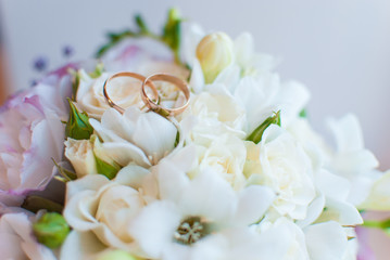 Wedding rings and bouquet