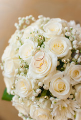 Wedding rings and bouquet