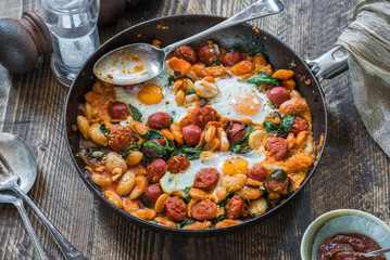Butter beans, chorizo and spinach baked eggs