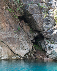 Large crevice in East wall of abandoned flooded quarry taken from base
