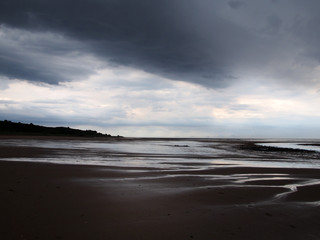 heavy storm on a beach with dark clouds