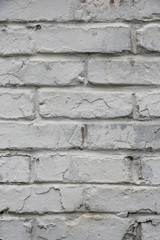 Fragment of whitewashed old brick wall, background