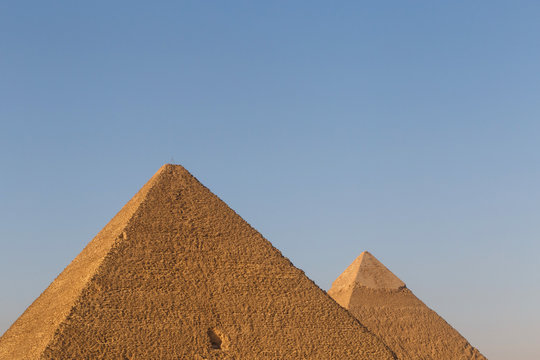 pyramids of Khufu and Khafre against blue sky