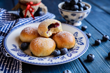 Fresh baked buns filled with blueberry jam