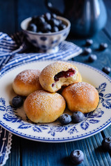 Fresh baked buns filled with blueberry jam