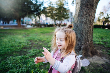 Little girl walking in the park