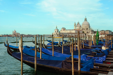 Obraz na płótnie Canvas Venice cityscape view on Santa Maria della Salute basilica with gondolas on the Grand canal in Venice