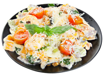 delicious delicious spaghetti with shrimps and basil on  plate