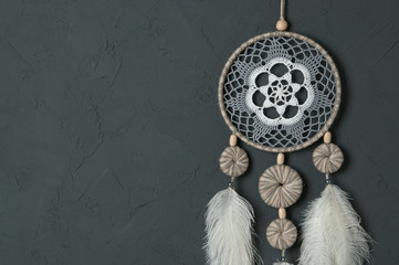 Gray white dream catcher on dark gray