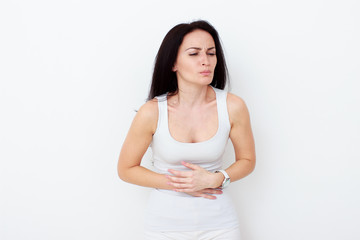 Obraz premium Woman with pain is holding her aching belly