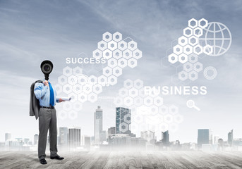 Camera headed man standing on wooden floor against modern cityscape