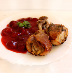 Chicken legs baked with sweet and sour cherry sauce
