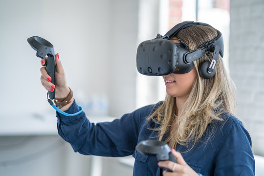Young woman wearing a virtual reality headset.