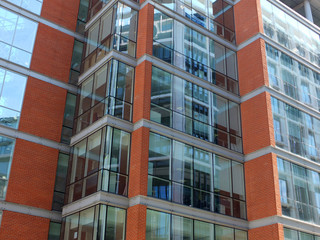 modern office building with brick details and floor to ceiling windows