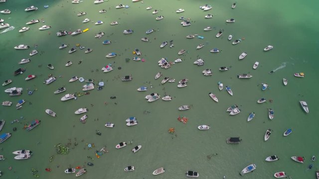 Aerial video boats at a sand bar 4k 60p