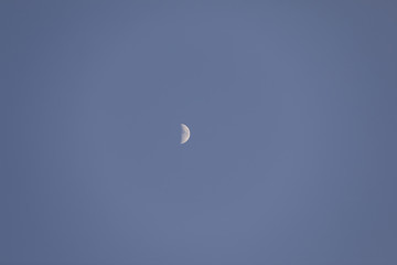 Half moon blue sky