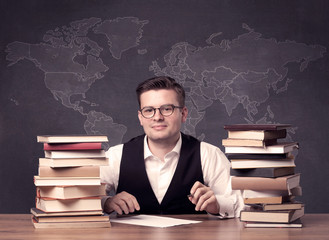 Geography teacher at desk