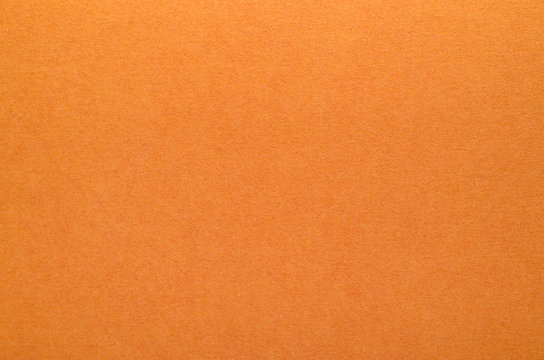 Bright orange texture of cardboard. Rough surface for background
