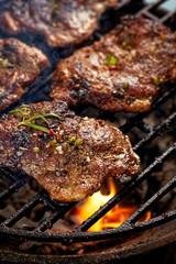 Grilled pork neck fillet steaks on grilled plate