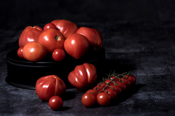 tomatoes  composition on black isolated  background