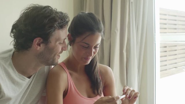 Couple pleased with pregnancy test results