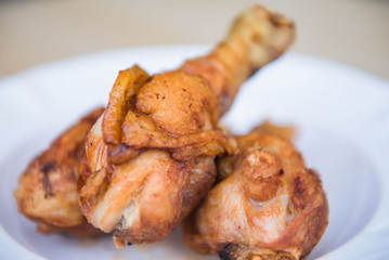 closeup fried Chicken on A White plate .