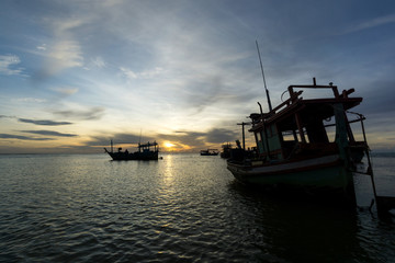 Fototapeta premium Morning light with a fishing boat