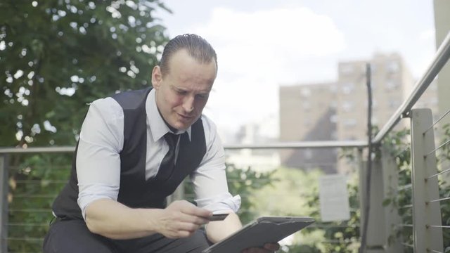 Businessman shopping online using digital tablet