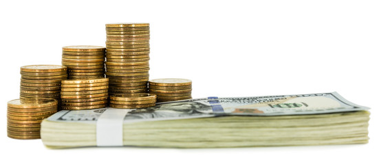 coins and stack of one hundred dollar bills isolated on white background