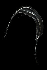 Fototapeta na wymiar clear water splash isolated on black