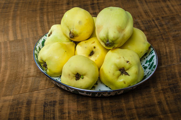 Quince fruit in metal bowl