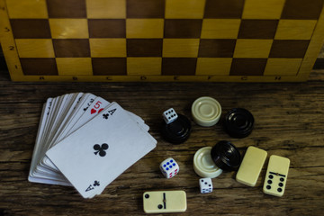Various board games chess board, playing cards, dominoes. Hobby. Metaphor for games and gambling.