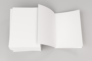 Stack of blank white closed and one open brochure mock-up on white background
