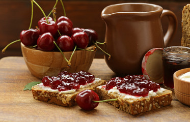 Sandwich with cherry jam and soft cheese © Olga Kriger