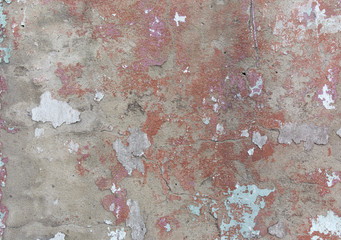 Old painted wall. Green and pink damage surface. Peeling paint background. Stone demaged backdrop.