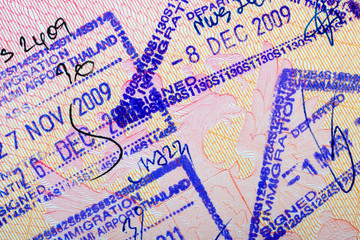 multiple thailand entry visa and departure stamp in passport