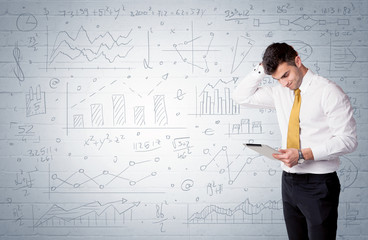 Salesman standing with drawn graph charts