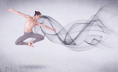 Fototapeta na wymiar Modern ballet dancer performing with abstract swirl