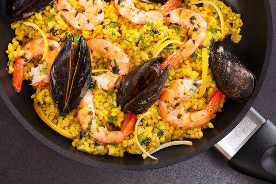 Delicious paella in pan.