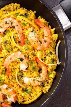 Delicious paella in pan.