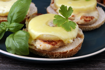 toast hawaii, , cheese and pineapple on wooden background with chicken breast