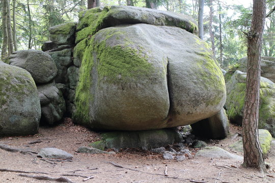 Rock structure Ďáblova prdel (Devil´s ass) in forest near Horni Meziricko, Czech republic