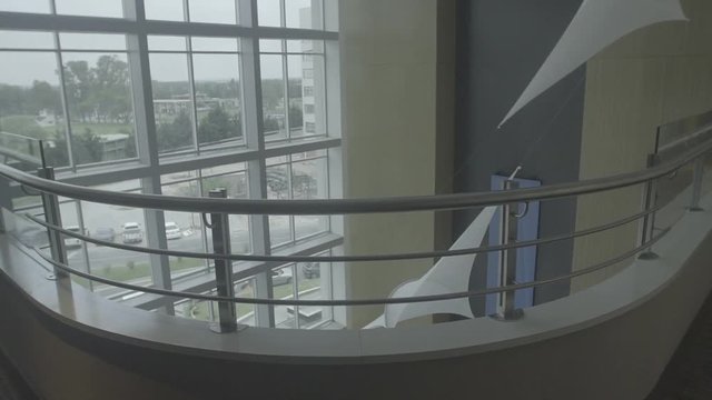 Looking down at luxury hotel lobby from upper floor