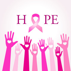 Diverse women hands joining for breast cancer awareness