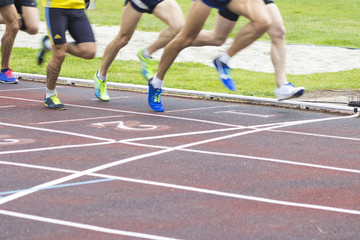 athletes running on the athletics track