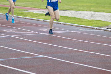 athletes running on the athletics track