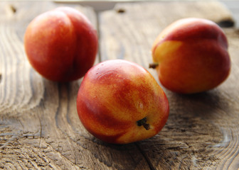 Fruit nectarines on a dark wooden background