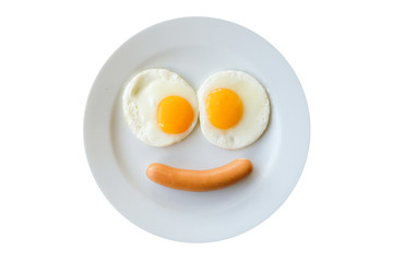 Smiling face frying eggs breakfast on a plate isolated white background.